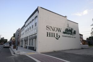 Building with Snow Hill printed on the side