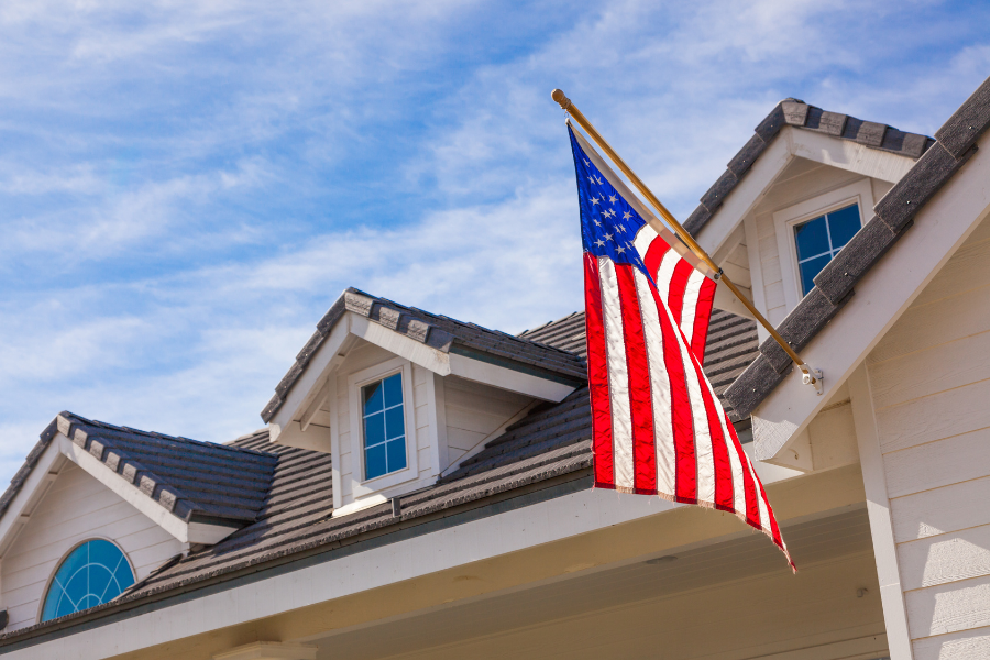 American flag in front of a storefront