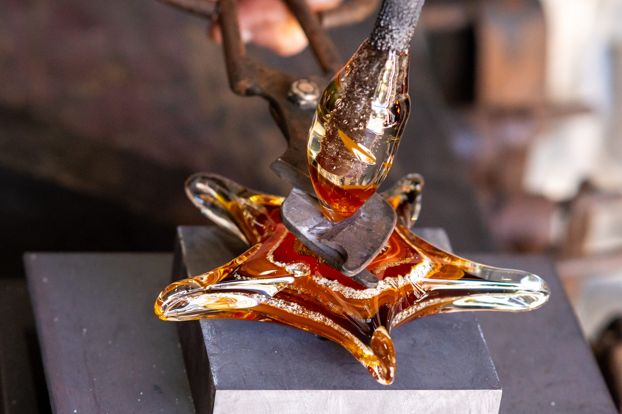 Glass blown star being created