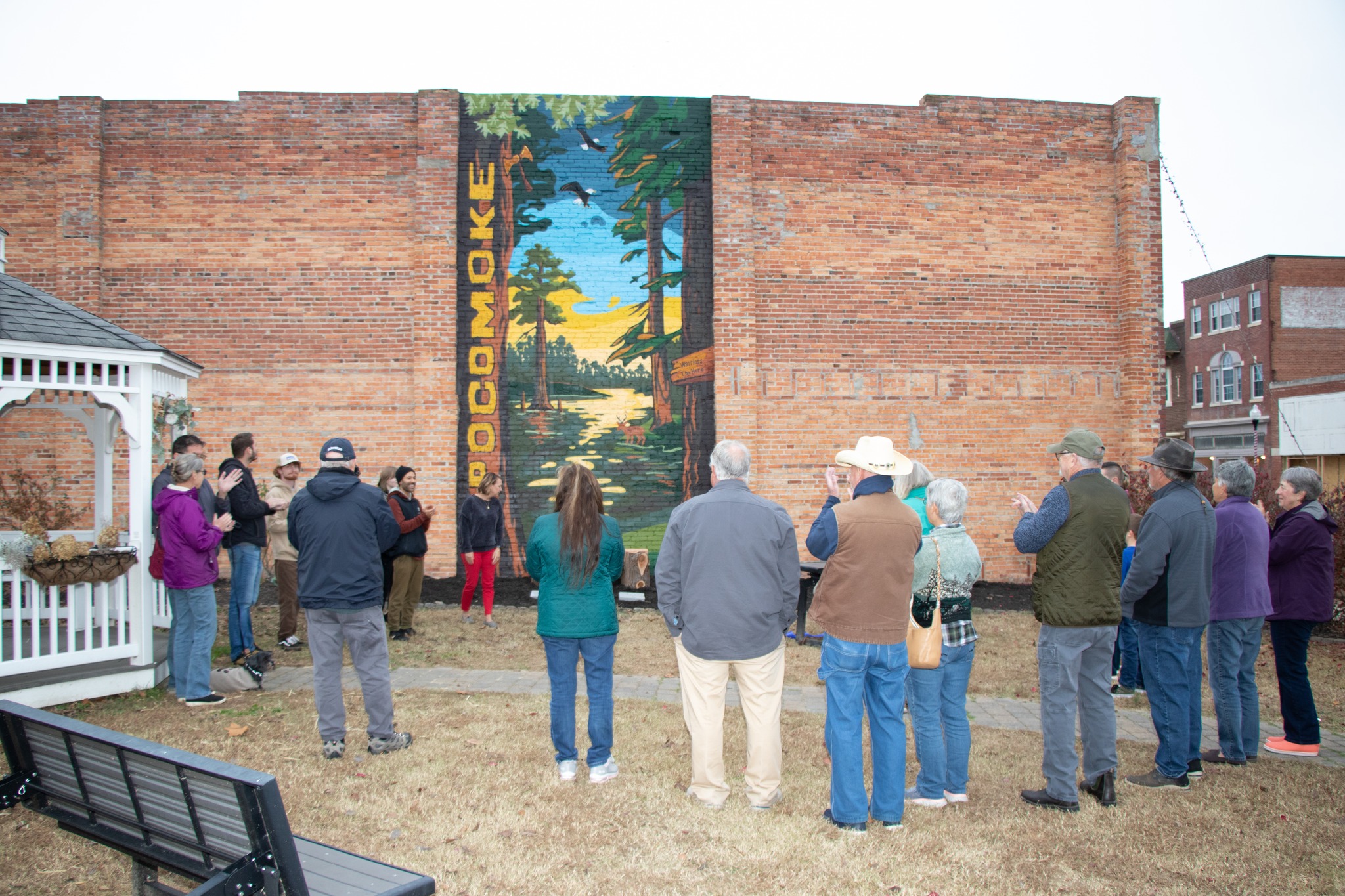 Colorful mural in downtown Pocomoke City painted on the side of Cypress Roots Brewing Company, featuring imagery that celebrates family, cultural roots, and Native heritage. Artwork by We Are Limitless Studios. Photo by Wulfhouse Productions.