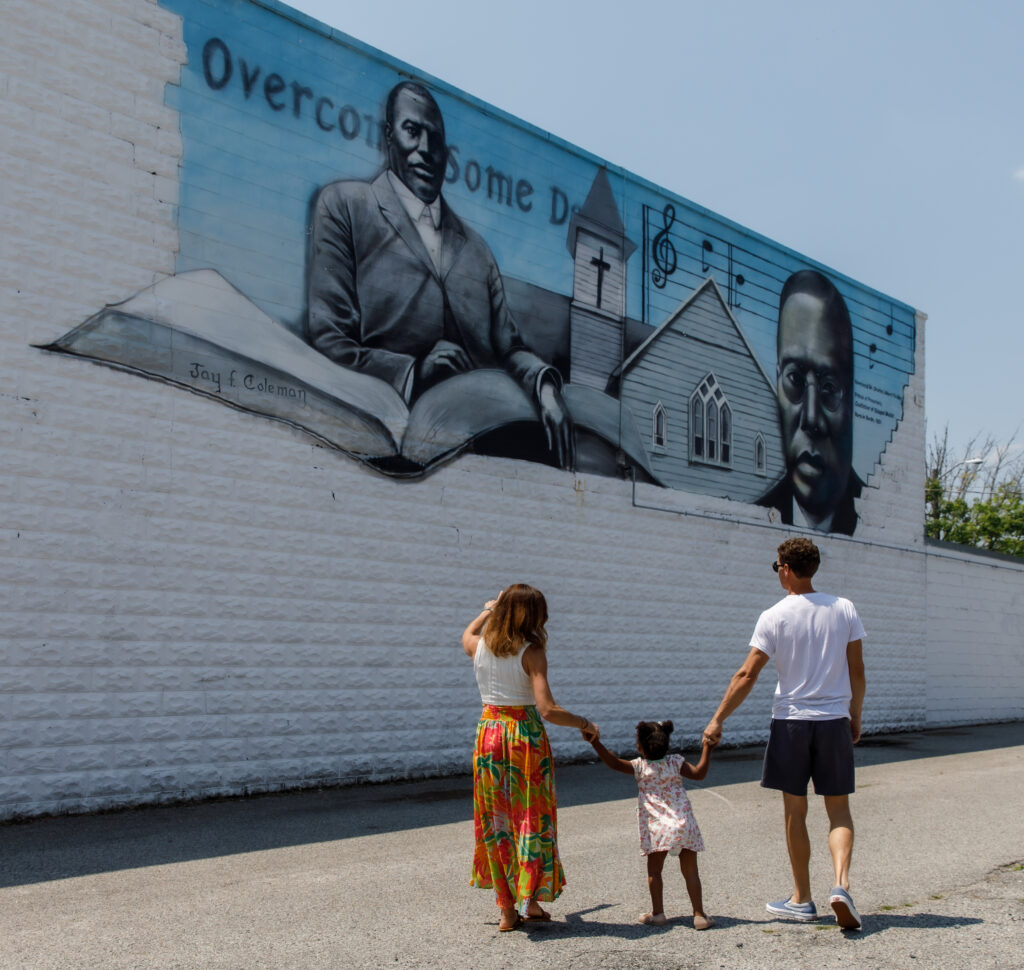 Family looking at the Tindley Mural in downtown Berlin, MD