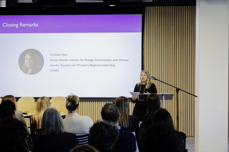 Corinne Speaking at Event